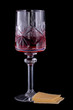 Wineglass with red wine and some cheese