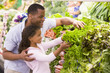 Father and daughter in produce section