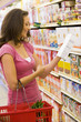 Woman checking food labelling