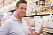 Young man grocery shopping