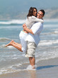 Couple in love having fun on the beach.