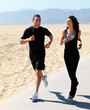 Young couple jogging on beach