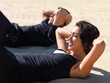 Young couple exercising on beach