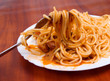 fork with spaghetti.wooden table fork with spaghetti.wooden table