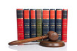 Wooden gavel and old law books Wooden gavel and old law books