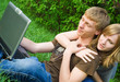 Photo: Young couple with laptop Young couple with laptop
