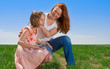 Mother and daughter outdoors