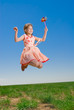 Happy girl jumping outdoors