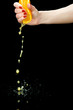 Squeezing an orange. closeup.
