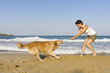 Yong girl playing with her dog