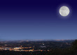 Night cityscape with moon