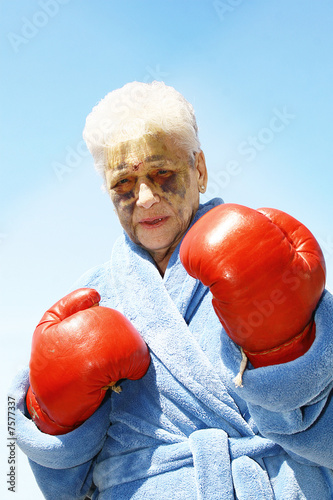Photo: Senior woman and red boxing gloves Senior woman and red boxing gloves