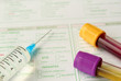 Syringe, test tubes and medical form