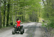 woman in red on four wheeler