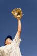 Baseball player catching ball in baseball glove, low angle view