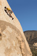 Man Climbing on Cliff
