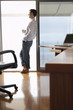 Man Relaxing by Sliding Glass Door