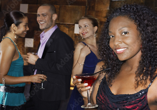 Photo: Young Woman at Bar Young Woman at Bar