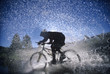 Bicyclist Splashing Through Water