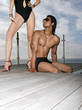 Man and Woman Beside a Swimming Pool