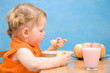 Little girl eating baby food