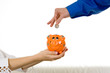 Saving money in piggy bank