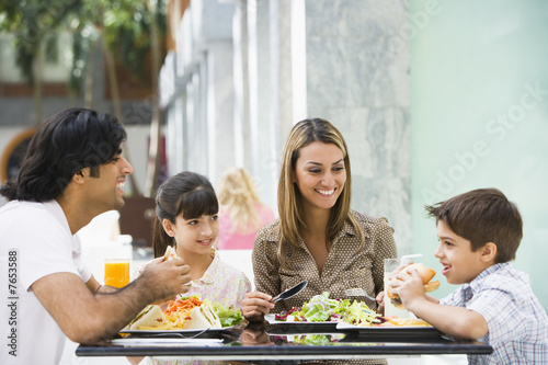 Photo: Family enjoying lunch at cafe Family enjoying lunch at cafe
