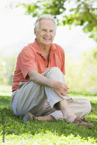 Senior man relaxing in park Senior man relaxing in park