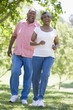 Photo: Senior couple having fun in park Senior couple having fun in park