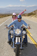 Bikers riding on desert road