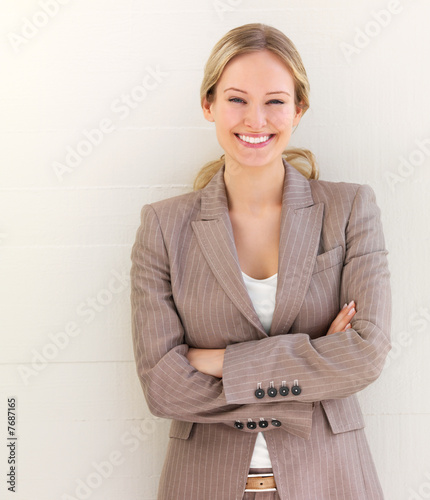 Young woman standing with arms crossed