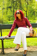 Beautiful young women on bench in park