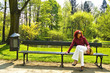 Beautiful young women on bench in park