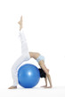 young Asian women working out with gym ball