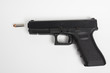 Photo: handgun on white background handgun on white background