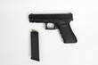 Photo: handgun with clip on white background handgun with clip on white background