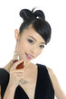 A beautiful asian woman poses in her  gown