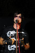 Portrait of young male singer performing live