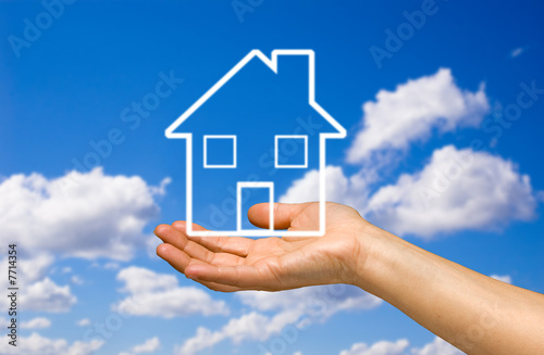 hand holding a home hand holding a home