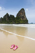 pink flip flops on deserted beach, thailand pink flip flops on deserted beach, thailand