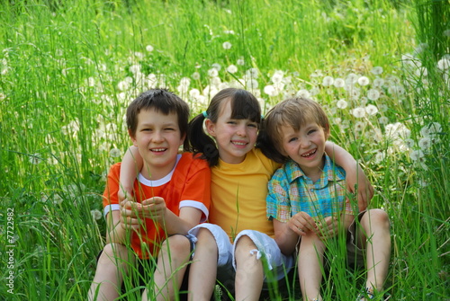 Children Sitting in Meadow