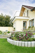 Yellow hous and summer garden.