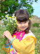 Photo: Pretty girl of preschool age with the bouquet of camomiles. Pretty girl of preschool age with the bouquet of camomiles.