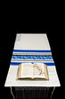 Jewish Prayer Shawl, Prayer Book, And Glasses