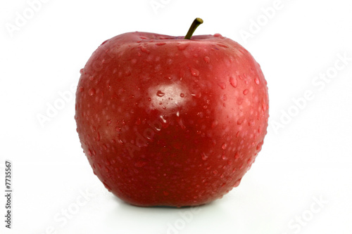 Photo: red apple with water drops on white background red apple with water drops on white background