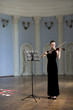 The beauty brunette plays the violin in concert hall The beauty brunette plays the violin in concert hall