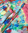 painter pallette with many mixed colors