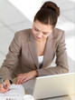 Business woman writing on paper