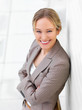 Young beautiful business woman standing with her arms crossed