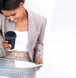Busy smiling business woman working and talking on phone